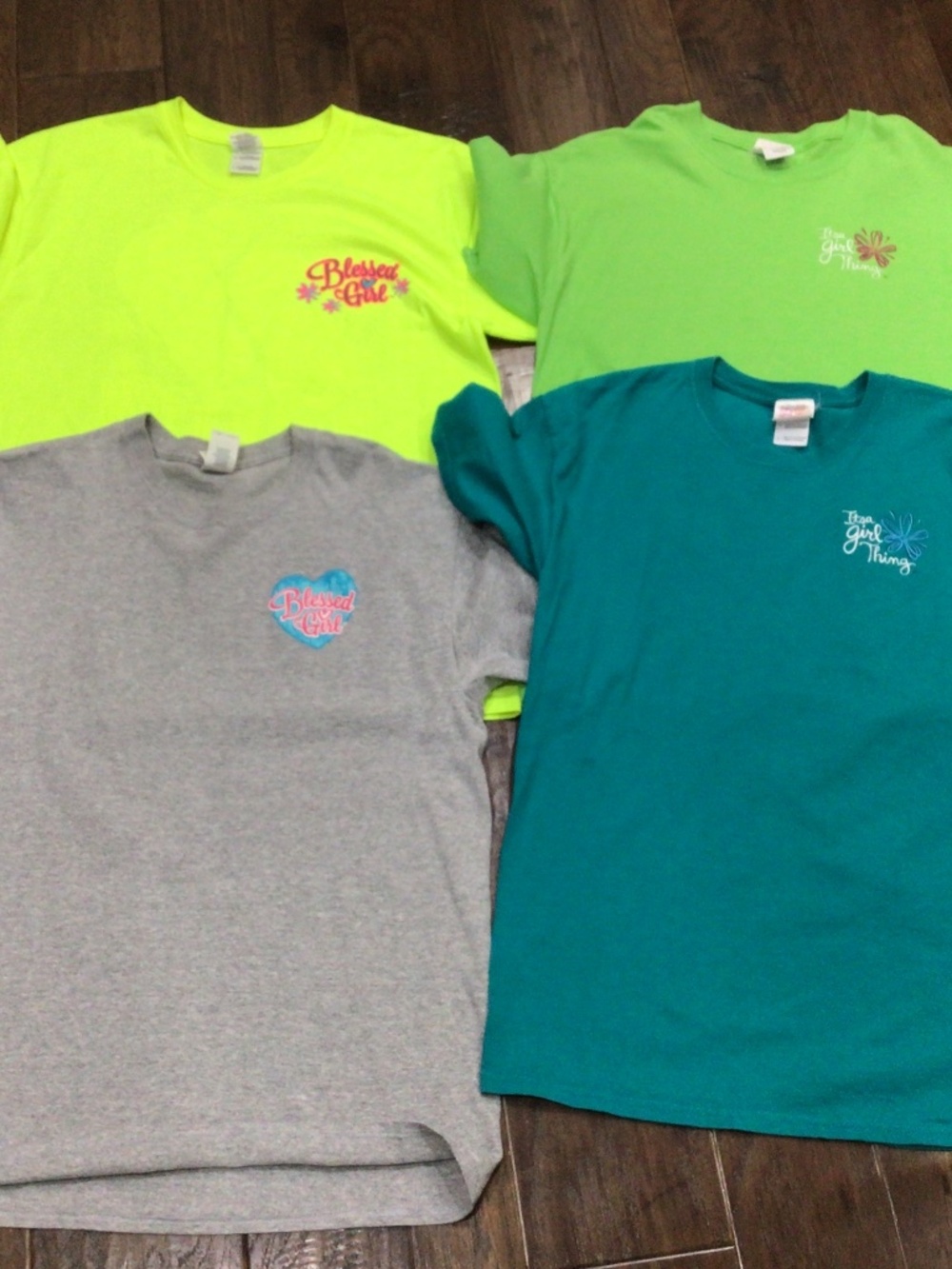 Four womens t shirts. Made by Gildan and Its a girl thing. size L  great shape.